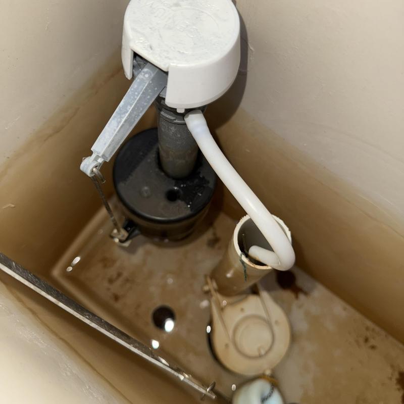 Toilet fill valve and angle stop inside tank