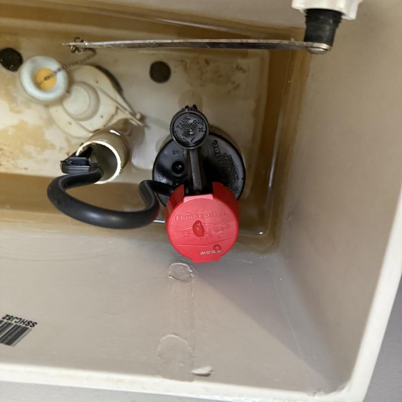 Toilet fill valve and angle stop inside tank