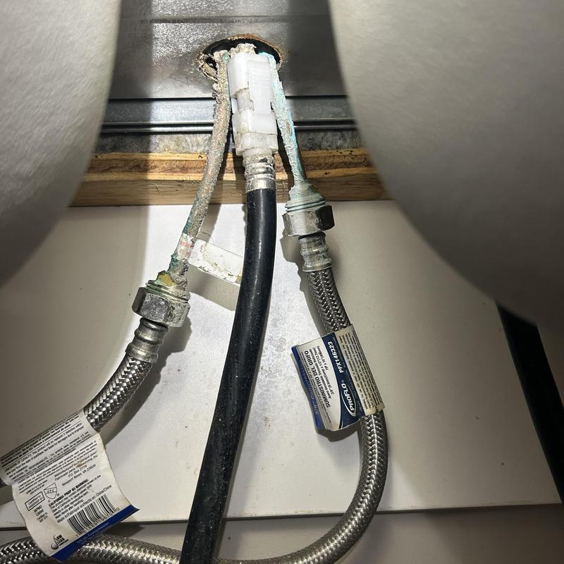 Kitchen faucet water supply lines with corrosion buildup