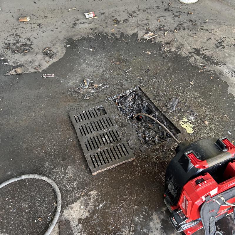 Car wash drain line with sewer machine cleaning