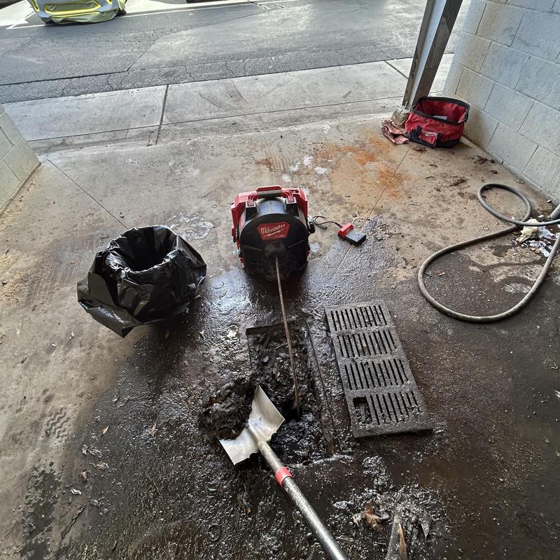 Area drain cleaning with sewer machine and debris removal