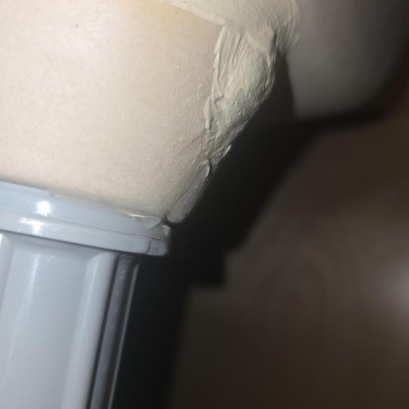 Porcelain bathroom sink with leak and repair area