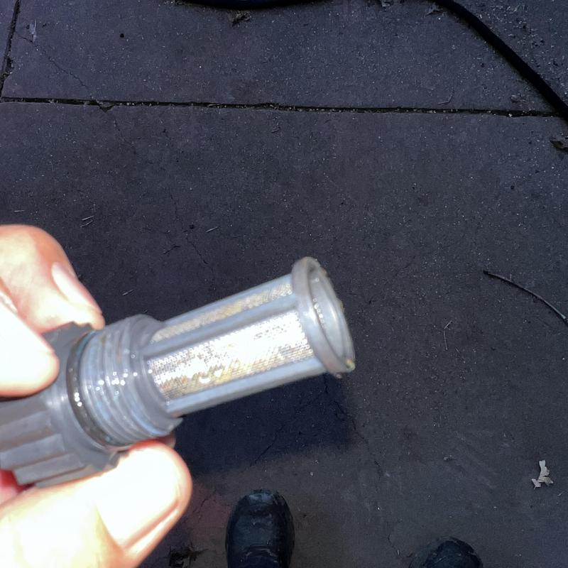 Tankless water heater water filter removal and cleaning