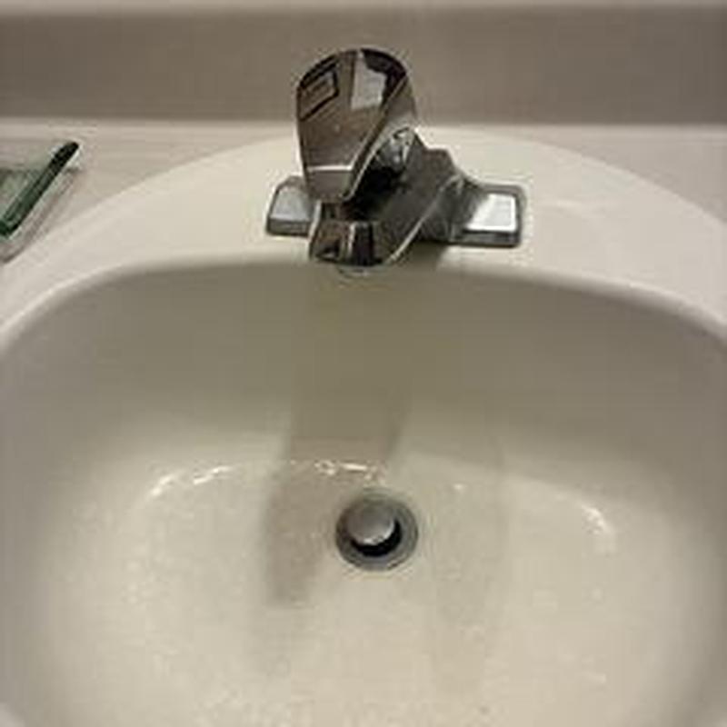 Bathroom sink faucet with handles and drain stopper