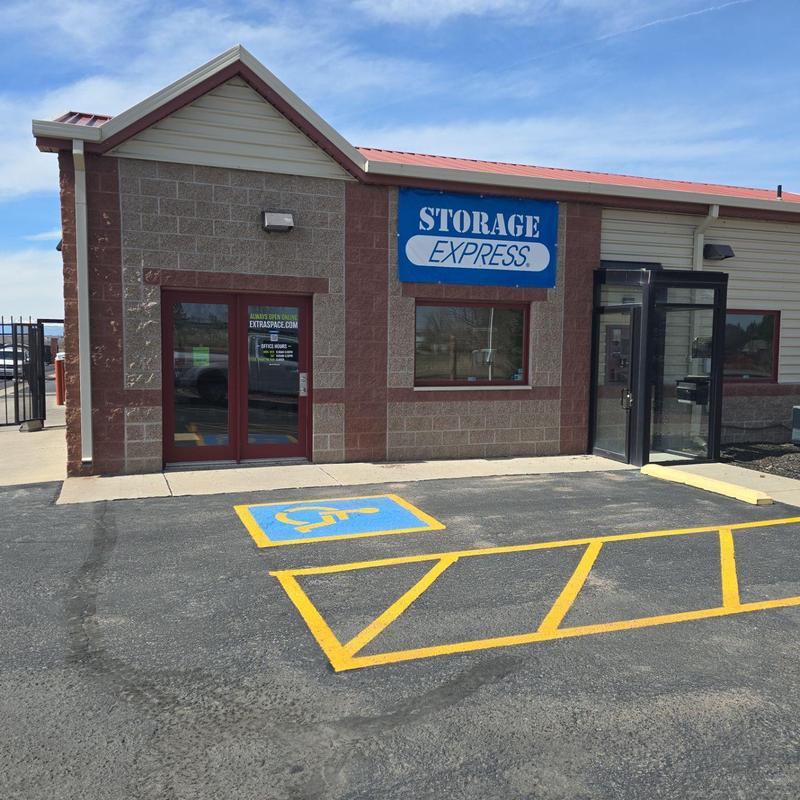 Metal roof above storage units with parking lot markings