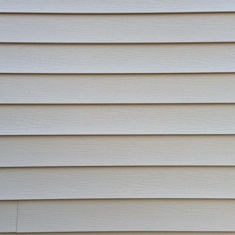 Vinyl siding in Prairie color installation close-up