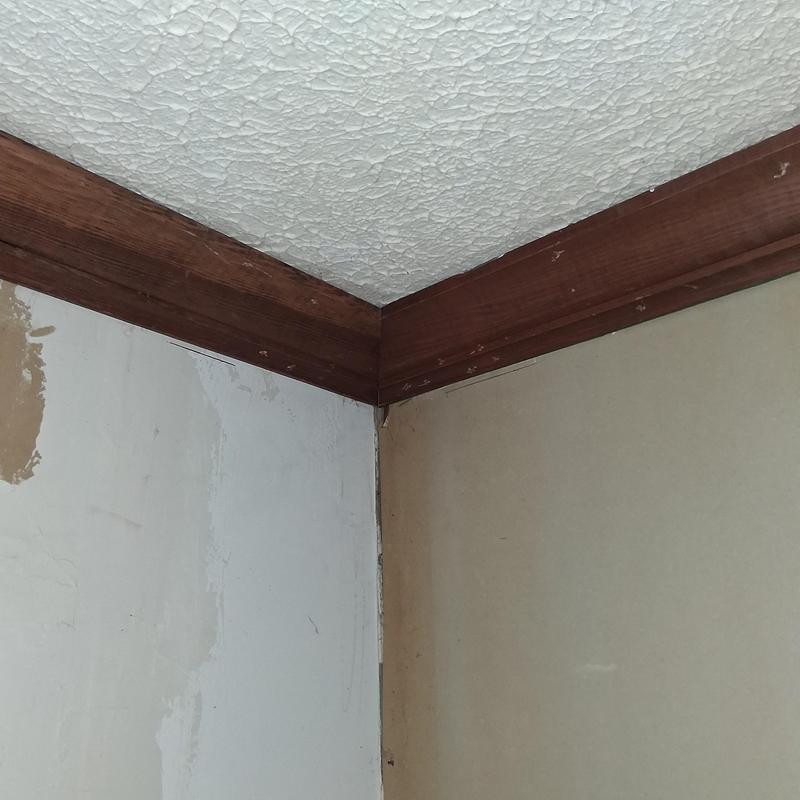 Wood crown moulding installation in room corner Wood crown moulding installation in room corner