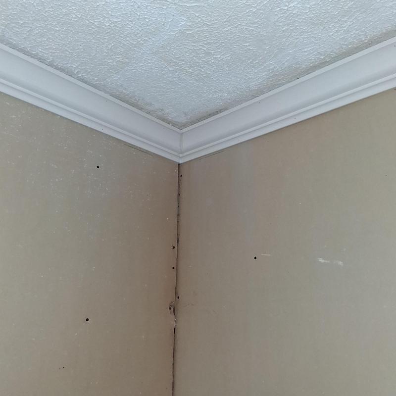 Crown moulding installed in interior room corner Crown moulding installed in interior room corner