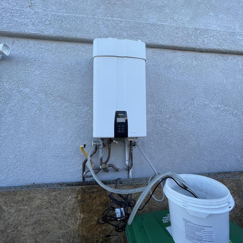 Tankless water heater flushing setup with bucket