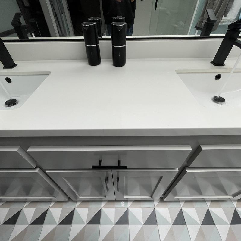 Matte black Moen lavatory faucets with sinks