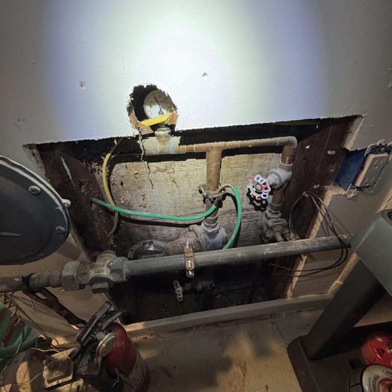 Main water supply valve with pressure gauge and piping Main water supply valve with pressure gauge and piping