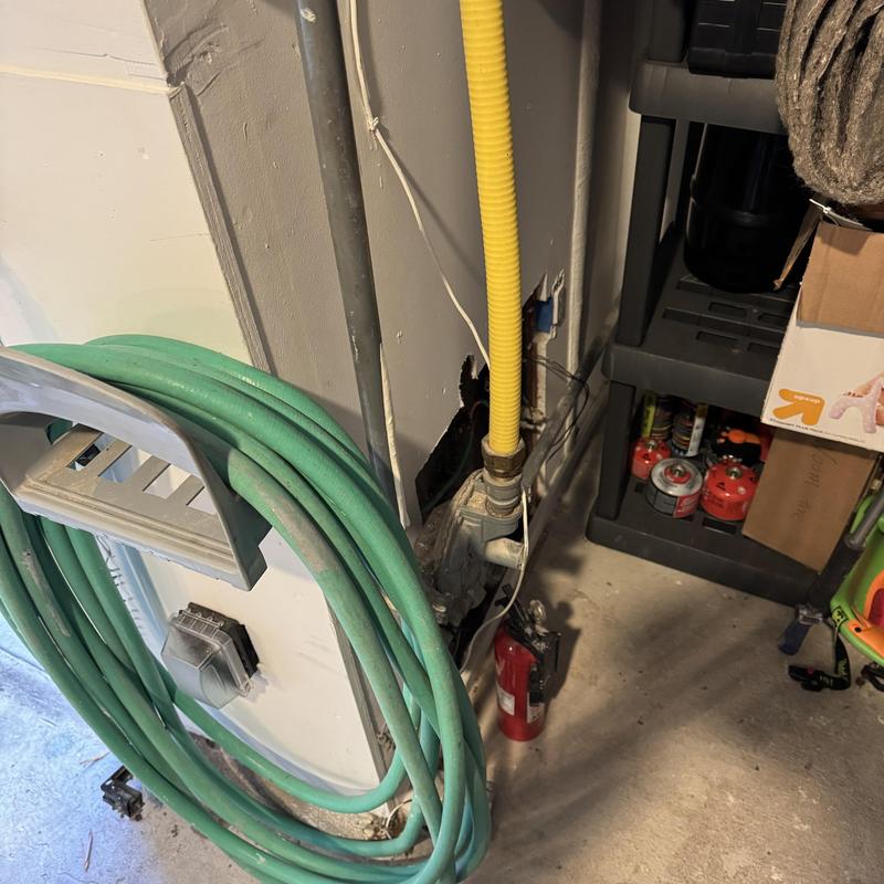 Gas line connection with yellow corrugated tubing and valve Gas line connection with yellow corrugated tubing and valve