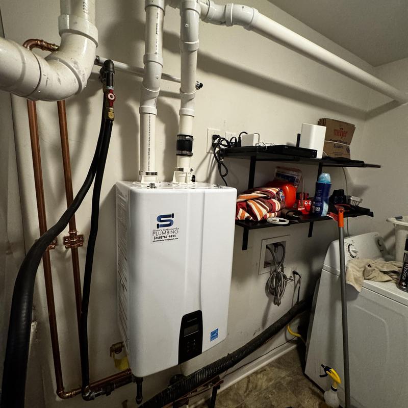Navian tankless water heater with plumbing connections