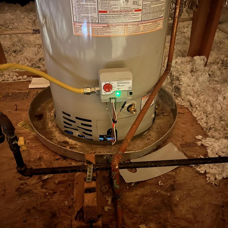 Bradford White gas water heater with safety valves in attic