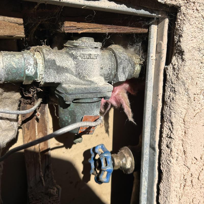 Pressure reducing valve and gate valve in wall fixture