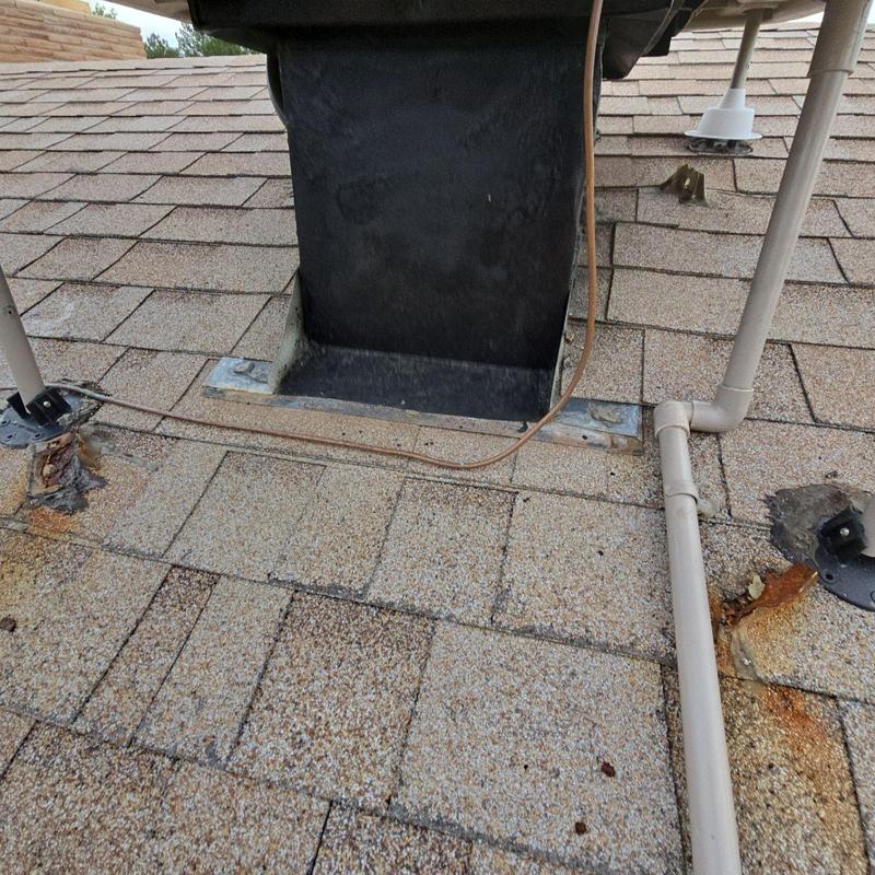 Swamp cooler resealed with silicone on shingle roof