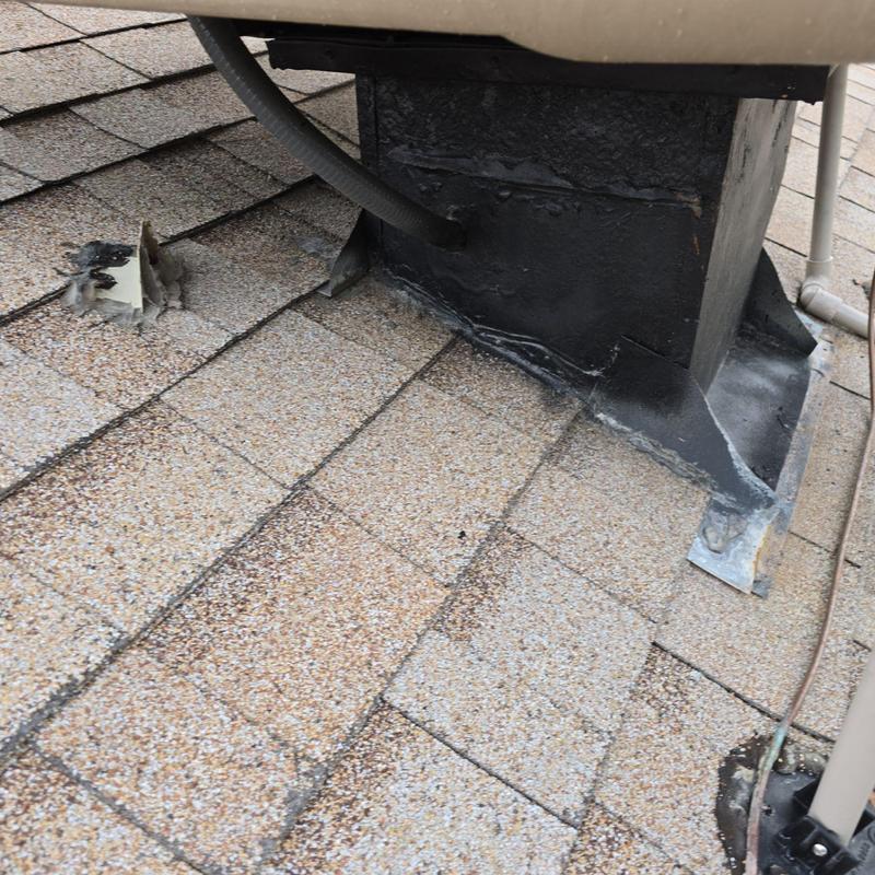 Swamp cooler base with sealed counterflashing on roof shingles