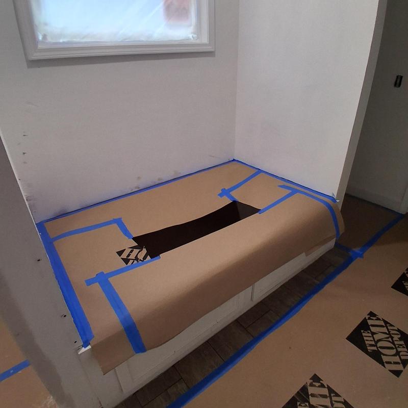 Tub protective barrier with cutout for plumbing access Tub protective barrier with cutout for plumbing access