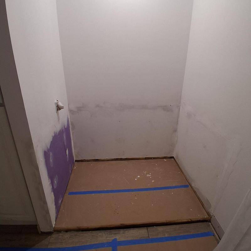 Sheetrock installation in bathroom remodel with tub barrier Sheetrock installation in bathroom remodel with tub barrier