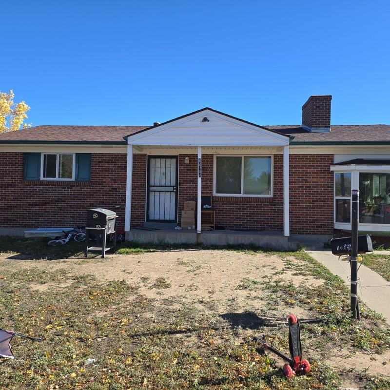 Asphalt shingle roof with extensive hail damage in Denver