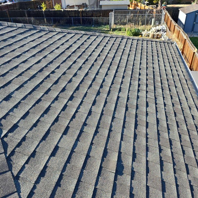 Asphalt shingle roof with hail damage from 2023 storm