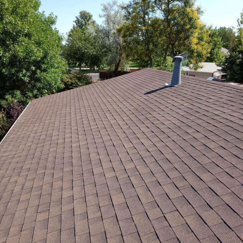 Asphalt shingle roof with hail damage in Montbello Denver