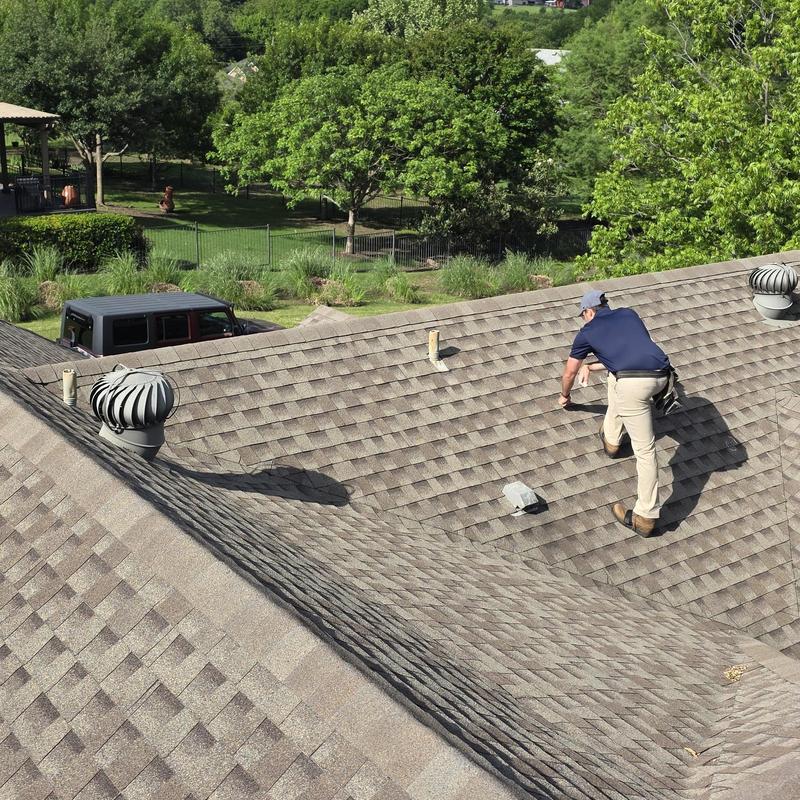 Asphalt shingle roof hail damage inspection with technician