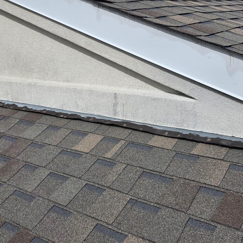 Roof shingles with hail damage near fascia board