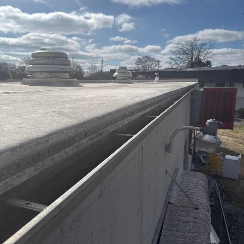 Flat roof ventilation units and metal wall flashing detail