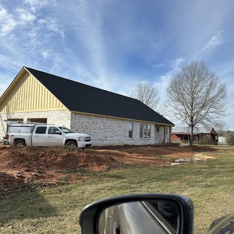 New brick exterior and roofing on new construction house New brick exterior and roofing on new construction house