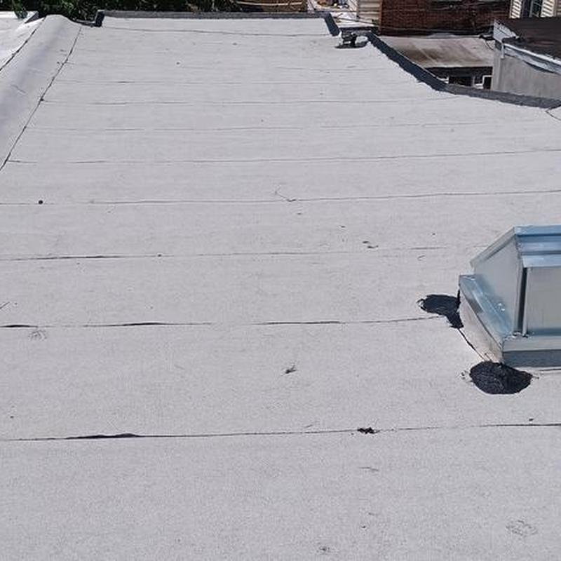 Firestone Modified Bitumen flat roof with metal vent Firestone Modified Bitumen flat roof with metal vent