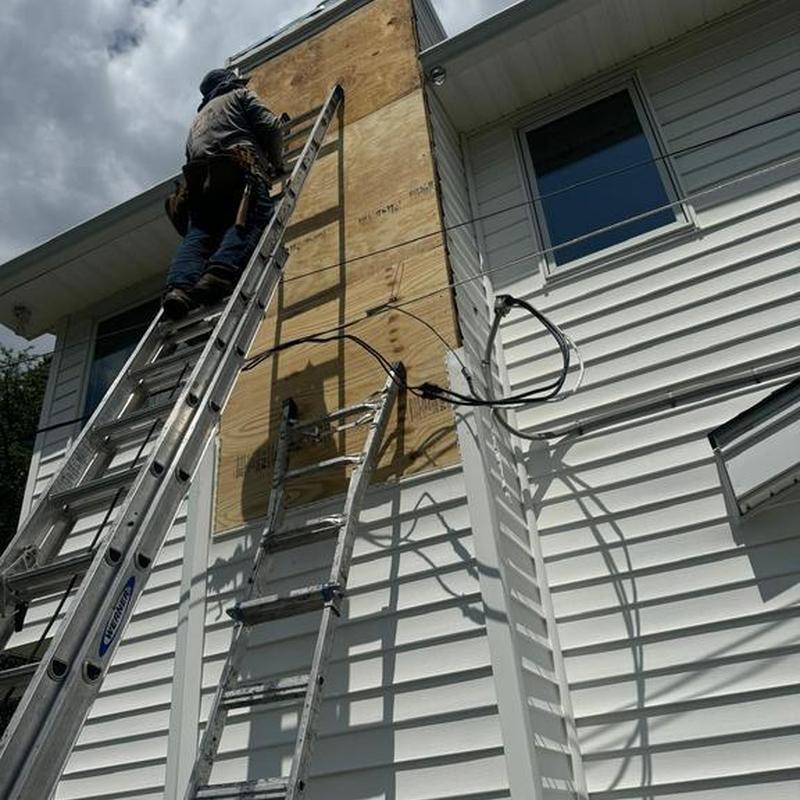 Exterior plywood siding panel installation on house wall Exterior plywood siding panel installation on house wall