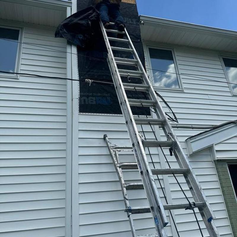 Siding panel replacement on second-story exterior wall Siding panel replacement on second-story exterior wall