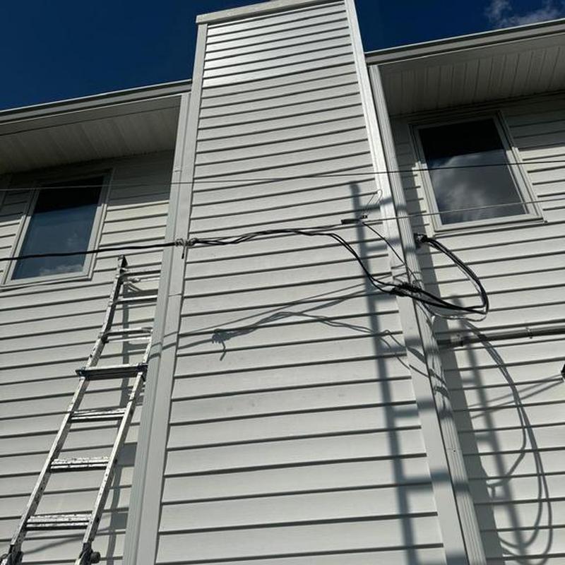 Vinyl siding with ladder and electrical wiring shadows Vinyl siding with ladder and electrical wiring shadows