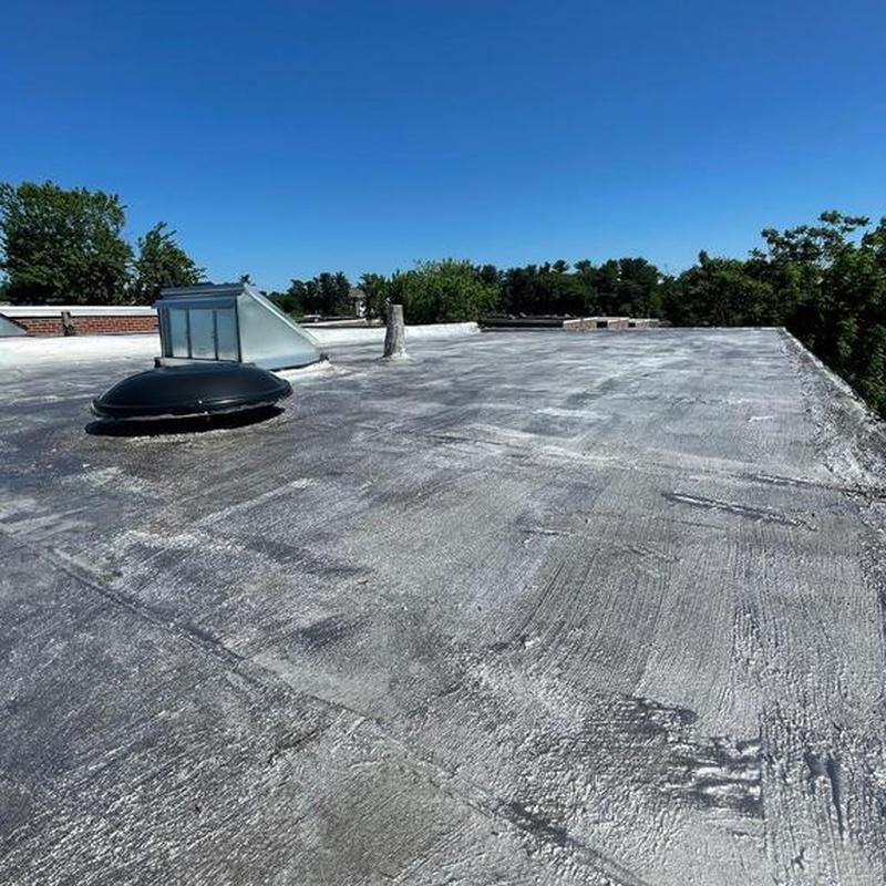 Flat roof with aluminum silver coating and flashing cement