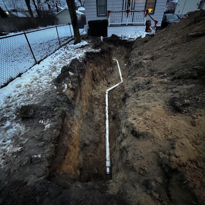 Collapsed sewer pipe replacement in deep trench outdoors