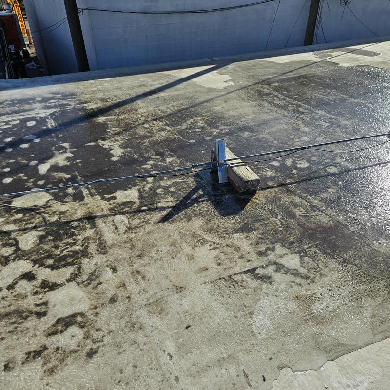 Flat roof with standing water and damaged seams