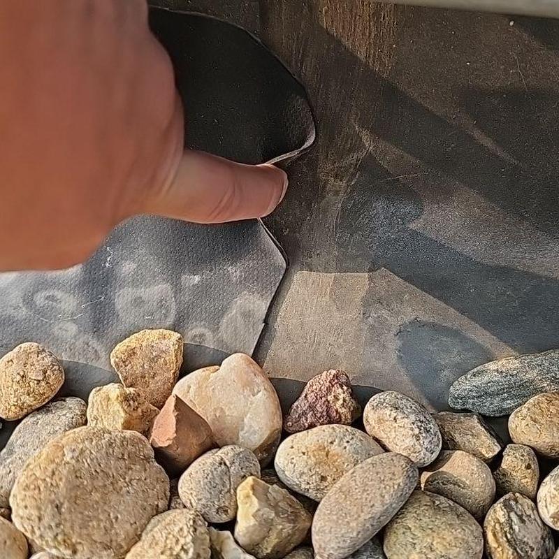 EPDM roofing membrane peeling near gravel ballast EPDM roofing membrane peeling near gravel ballast