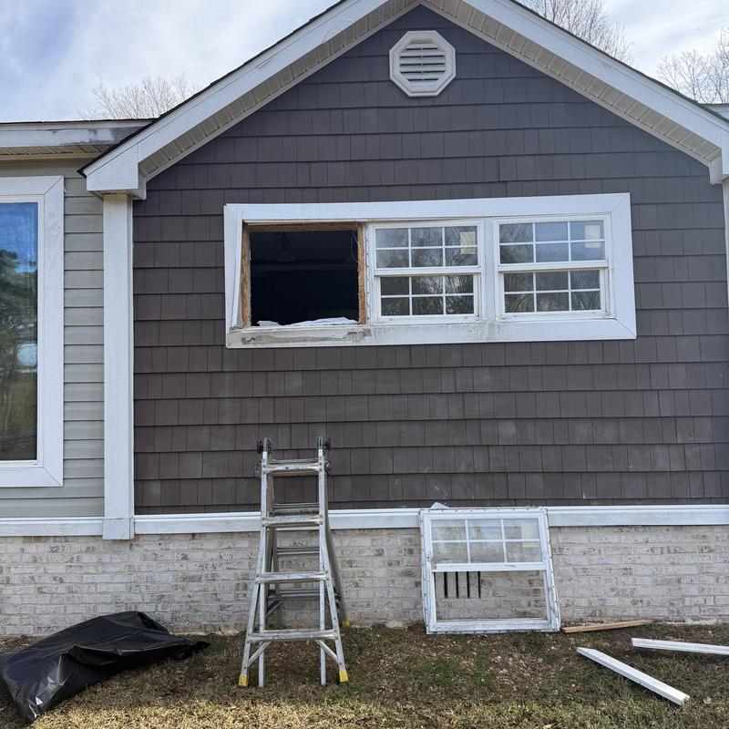 Window frame with old pane removed and new pane ready Window frame with old pane removed and new pane ready