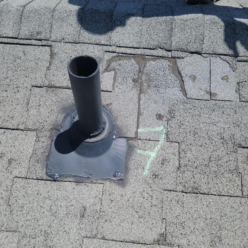 Roof vent flashing with damaged T-Lock shingles and marking Roof vent flashing with damaged T-Lock shingles and marking
