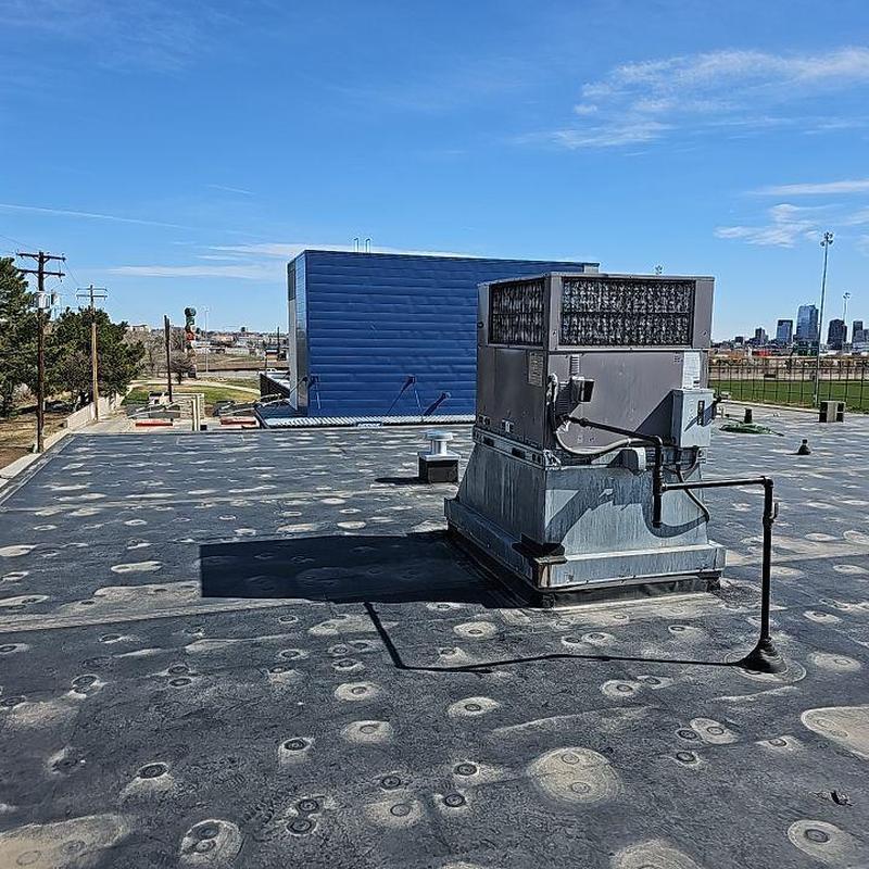 EPDM flat roof with HVAC unit and seam repairs EPDM flat roof with HVAC unit and seam repairs