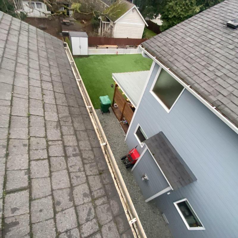 Gutter system cleared of debris on residential roof