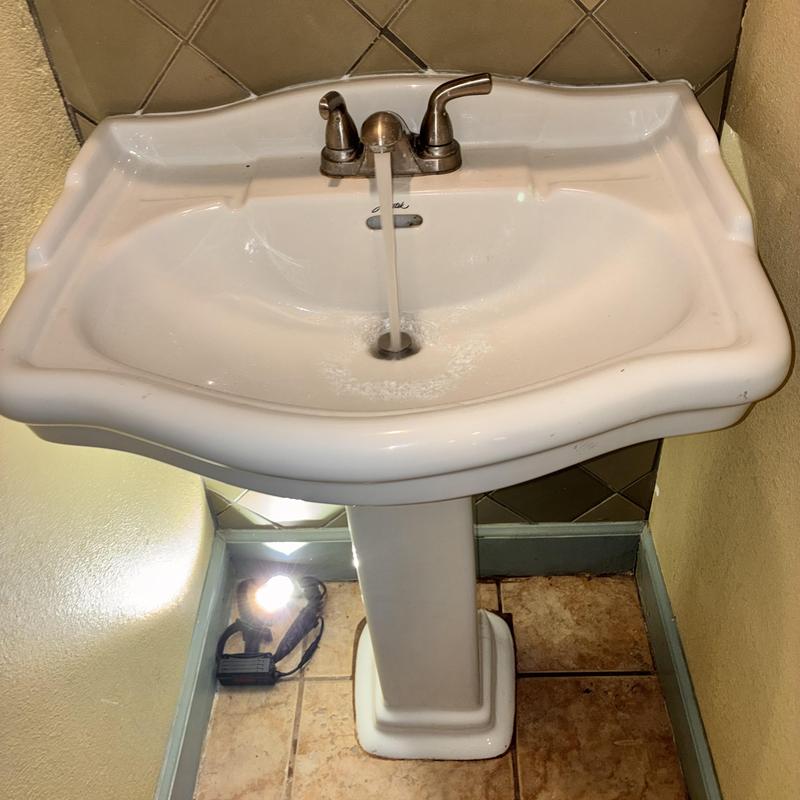 Pedestal sink with running water and faucet fixtures