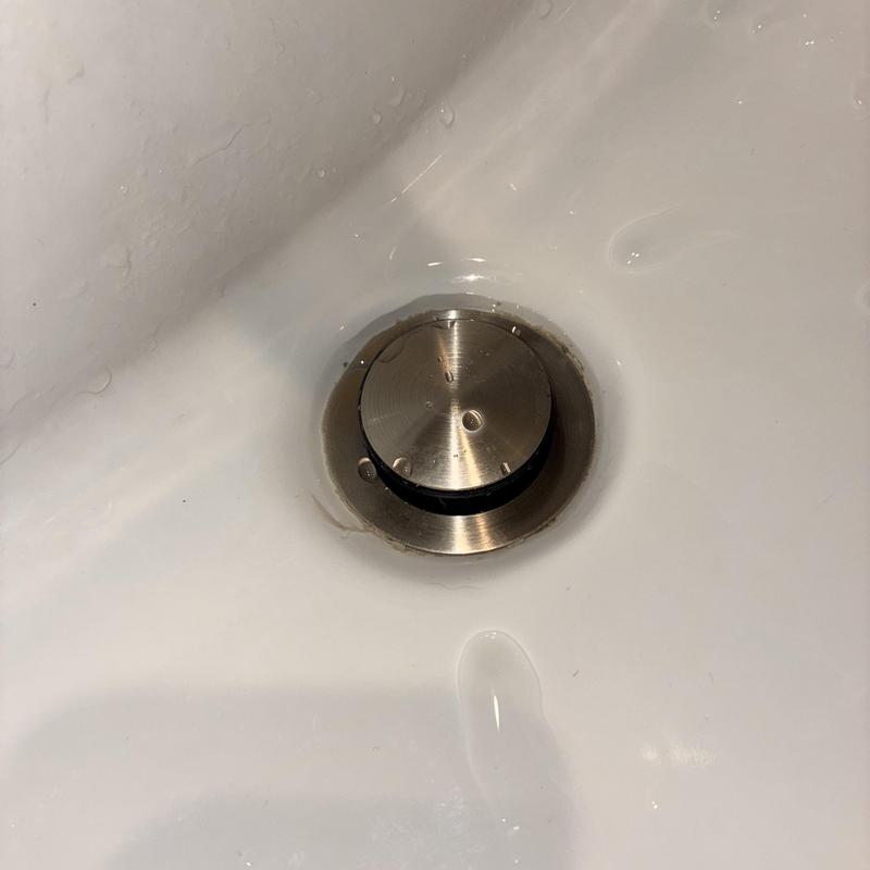 Pedestal sink pop-up drain assembly with new caulking