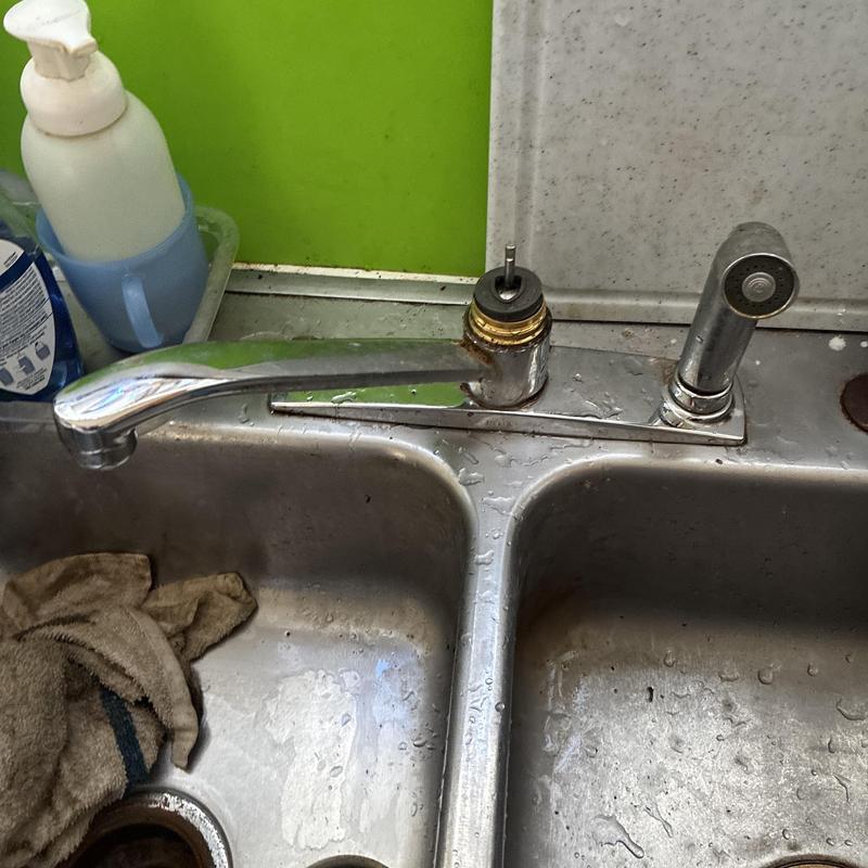 Kitchen faucet with removed handle on double sink