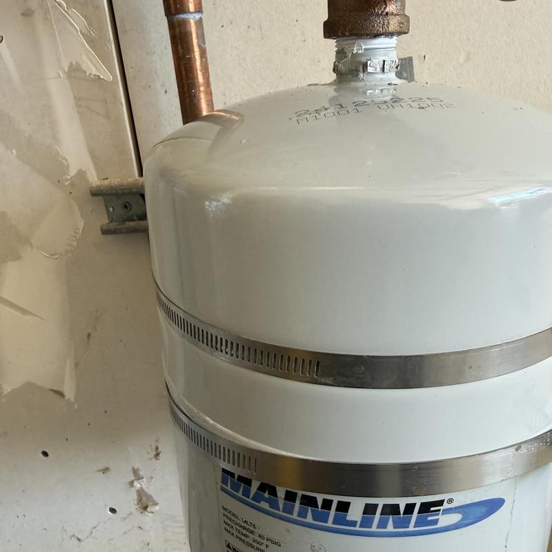 Expansion tank with copper piping in residential wall Expansion tank with copper piping in residential wall