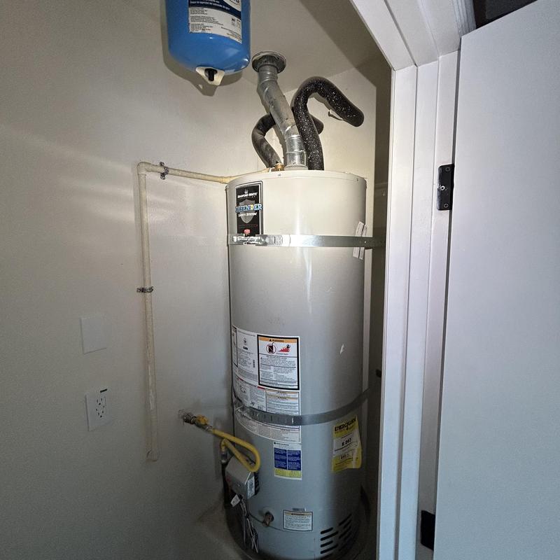 Tankless water heater installation with new venting