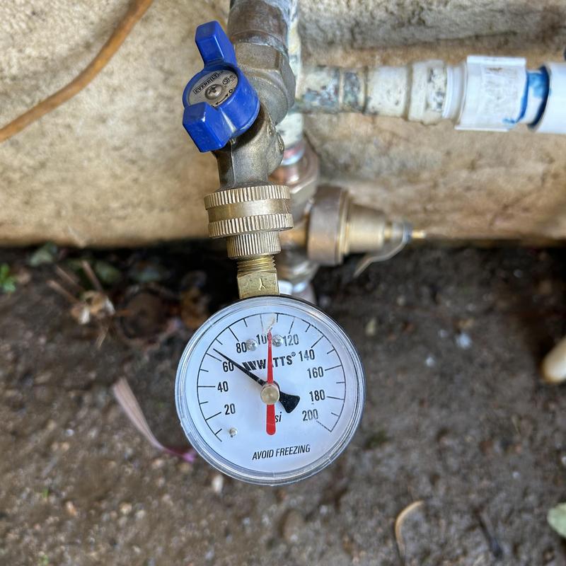 Pressure gauge with blue valve and copper piping