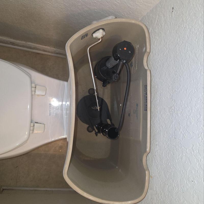 Toilet tank interior with installed fill valve parts