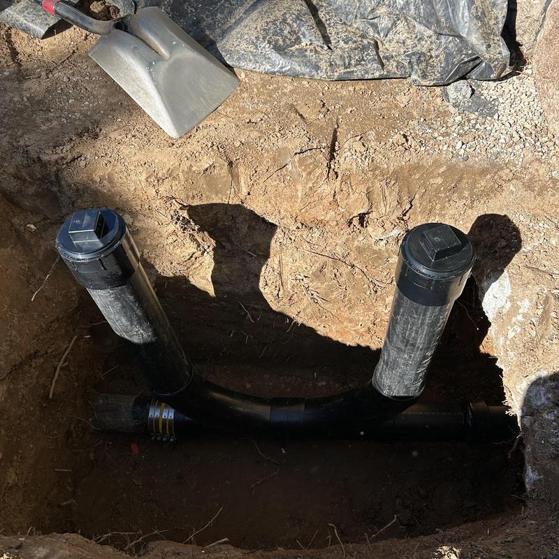 ABS drain line with two clean out caps installed